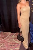 Loved this dress! Fit just how I wanted it to! The neckline is strapless, and has a pretty thick clear band so it's easy to stay up! - Kaylee L.