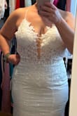 I just purchased this dress for a 30 year vow renewal and it is gorgeous. The material is a little scratchy but only on the outside and the glitter is loose, but it is totally worth it for the look. I ordered a 10 but it was too large and the 8 fits perfectly. I'm 5'1 so I will need it hemmed, adding a belt, and also I will change out the white pads for nude ones. It will be just perfect. - Dina S.