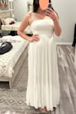 I am soooo sad about this dress, because it arrived with a giant rip at the seem and a black spot on the back, otherwise I probably would have kept it! It's simple, yet elegant. And the ribbon straps are so fun! - Margaux E.