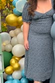 I was worried it would be too small for me, but it was actually, ever so slightly, loose. Very comfortable. The dress tends to ride up so I did have to pull it down occasionally. Wore it for a baby shower but I will definitely be re-wearing it for other events. I also was inspired by the model and wore white boots with it, too. - Megan J.