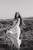 The dress is a lightweight (perfect for summer) outfit and looks the best in pictures! I will say it's a tad see through with bright sunlight but other than that this dress is a must have! - Addisyn P.
