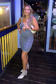I wore this dress for a "denim and diamonds" themed night out and loved it! Fits true to size. My only complaint is that the straps kept falling down and I felt like the slit in the front was pointless as it disappeared half the night from the dress riding up. - Alexa S.
