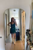 I wore this to a work holiday party that was 20s themed and got so many compliments. I ordered the green and ended up wearing it with sheer black tights and a black turtleneck underneath. It was a little short; I was pulling it down all evening, but honestly if it wasn't a work event it wouldn't have bothered me, especially with the fringe coverage that extends a little lower. I also definitely could have gone bra-less if I wanted to, the dress fit nicely and the fringe covers a lot. Highly recommend! - Abigail L.