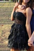 Dress was great and perfect for the occasion, I will say it was a little itchy and I had to pull it up quite a bit but that's to be expected with strapless. - Peyton W.