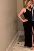 Super stretchy and comfortable. Looked great on, the slit is just way too high. I liked it overall so i sewed the slit an additional 5 in. The material is not plain black. Its almost like a shimmery looking stretchy fabric. Very pretty though. Too maybe a little looser than i would have liked, just made me little aware of side boob possibility. - Andrea M.