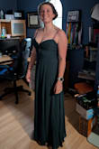 What an absolutely beautiful dress! I usually waver between a medium and a large as I carry a little extra around my mid-section, but I went with a medium and it fit PERFECTLY. I received so many compliments throughout the evening! I wore heels as the dress was long (if I had enough time I would have tailored and that really helped. The only warning I will give is that the "slit" in the front goes ALL THE WAY UP. So if you are not careful, everything will show. I corrected this by throwing a few stitches along the opening and that held great through all the dancing! Could not be happier with my choice! - Mel E.