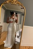 I chose this dress as the one! It's simple and gorgeous and exactly what I was looking for. I'll have to alter the top to fit my small chest but other than that it fits like a glove. I can't wait to wear it on my big day! - Kristen B.