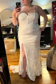 This dress runs very small and the top is very uncomfortable. The sequins are scratchy, the back did not zip up it was so small, and the cups were very misshapen from packaging. I cannot imagine this dress being comfortable unless you are tiny. Not made for curvy girls, short torsos, or bigger breasts. You need a slender waist or longer torso. I was also disappointed in the way the train fell because it wasn't long enough. I wanted the bad reviews to not be true, but I agree that this felt like a cheap cocktail dress. Definitely not bridal enough. - Kaetlyn M.