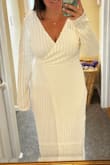 This dress fit better than expected and was flattering for my body! It was a little itchy but really not that bad! - Emily D.