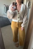 Comfy and slightly more relaxed fit, but it does cinch to create shape. I think the material is very soft and it isn't feeling "cheap". Definitely glad I snagged this! Been eyeing it for the past year. - Brandie R.