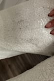 Had issues with the sizing; my chest is too small to keep it up, but I can't go down a size because my bottom is too large to go down, and this size is almost too tight on my rear. It also had a black stain when I took it out and tried it on. - Lauren R.
