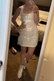 This dress is so cute and fun; however, the straps aren't adjustable and they are too big for me so I couldn't wear this to the event I purchased it for. I think it would fit someone with a larger chest much better, but for me it ran a little big in that area. The rest of the dress is very true to size and there is some stretch making it comfortable to wear. - Randi C.