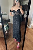 This is so elegant! The corset is stiff and snug. The length is shorter than I expected but hits right at the ankle to show off the heels. Getting the dress was a struggle. Would have been easier with a helping hand. But managed to wrangle myself into it! I was going to wear this for NYE but can't say I'd be able to dance it in. Definitely a gala gown. I'm obsessed. - Cecilia O.