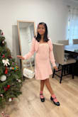 I bought this dress for my daughter. She is 10 years old and she is on the taller side for her age. She picked this dress from the site when I asked her to pick one for the holidays. I got her size XS and it fits her perfectly. We loved the fabric quality so warm and soft. The silhouette is perfect for her and she loved that it was a set and that the cardigan was a separate piece. Definitely recommend! - Maria M.