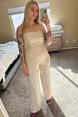 This jumpsuit is so cute! The back detail styles piece so well a I purchased for the holidays and NYE. I ordered a small and it fits perfectly! I am 5'7" and the pants are the perfect length on me. - Stephanie C.