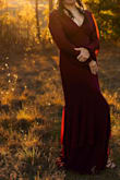 I bought this dress in size Large for a family photo shoot. For my perspective this dress runs a little bit large because I am big and tall person my measurements are 42 hips, 34 waist and 5,7 tall and it still a little bit large and long for me. I bought the burgundy which on the page appears to be more bright but in person, it looks like more like the purple color. In general, I recommend this dress to anyone, it very pretty and it makes you feel like a princess. I'm planning to buy the black color as well for future events. - Irene E.