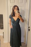 I loved this dress on the model, but there are many issues with the fit. The chest area is very open, and due to the open back, it's difficult to find a bra to wear with it. I have very small boobs, but I dont feel comfortable not wearing anything. I felt like I would be exposed at any moment. I still loved it and found a low back bra on Amazon to wear to my event. With the top, it was somehow adjustable to small chested women. I also wish it was 1 or 2 inches shorter as it hit me on the ankles. - Kassia V.