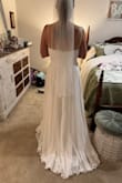 This is my dress! I did order a size larger than I normally wear. I ordered the large (I am usually a medium and wear a size 6 or 8 in everything) and it fits PERFECTLY! Zero alterations needed. This dress was made for me. I can't wait to wear it on my special day. The photo from the front is me trying to control the tears when I put it on and just knew it was the one for me!
It is also amazing quality for the price! Thanks, Lulus - Meredith M.