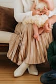 True to the pictures.  Nice quality skirt! - Suzanne F.