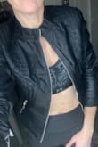 I always order small from Lulus but am on the Sm/med line. This jacket is sized up. It fits exactly like it shows. Sleeves are a little short. Very right in the back if I reach forward, especially if zipped. Will look nice with jeans and a tank but definitely not something to wear as a jacket- will not fit over anything- does not stretch comfortably. Size up if you want to wear it over a shirt or to keep you warm. - Jennifer R.