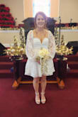 Dress was very beautiful!!! It literally fit me perfectly. I had a small wedding and was nervous I wouldn't find something in my price range that still made me feel like a bride. This dress made me feel so beautiful. The material is not stretchy.. if I was 1 inch bigger, it wouldn't of zipped. But everything about it worked perfectly for me! - Chelsey W.