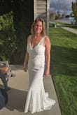 This wasn't my dream wedding dress but it was perfect for a simple elopement. The first photo was when I initially tried it on. It was a bit frumpy in the stomach/breast and the slip was longer than the lace. I did get it altered so the slip wouldn't show and for the upper part to be a tighter fit. The train length was perfect! I wanted a little bit of one but not to the point I needed a bustle. The fabric quality was nice too. Can't beat the price point which also made me not mind getting it dirty in the sand/ocean :) Overall, 4.5 stars because I did have to get it altered and the slip was too long. - Lindsey H.