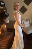I have been looking for a dress for our elopement and wanted one that would pack nicely and be classy but not too over the top. This dress met all my expectations and was perfect for me. It is not stretchy but fits and hugs all the curves like I had hoped. I can't wait to wear it on the beach! - Amanda O.