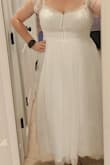 I was so hoping this dress would work for my reception in April. It was a little tight in the chest area but was ok without a bra on. It was the perfect length and I felt like a fairy princess. But...I had to return it. I have eczema which shows itself by being sensitive to some materials and textures. The sleeves and chest/back/torso were not something I could tolerate for more than the 10 minutes I had it on. I tried thinking of several different solutions but with how tight the chest already was, there wasn't a workable solution, unfortunately. - Rachael A.