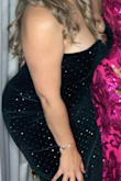 This dress has a lot of stretch to it and hugged all of my curves just right. Slit was not to high. - Gladys H.