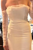 Dress. Is really pretty and good quality. I ordered a size too small, and decided to go with a different dress. I have tried dresses on from $1k up to $4K, this quality isn't far off honestly. - Ashlyn T.