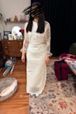 I really liked this dress. It was given to me. I did not buy it, so the size was too large for me. It has stretchy fabric and if you aren't careful it can snag on jewelry. Elegance with a little sass, as it has an open V back and a slit up the leg. - Nicole P.