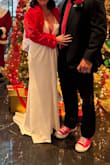 This dress is absolutely stunning. The sleeves were a bit loose and long, so I had them altered, and then the dress was perfect for me!
Due to the low cut, the shoulders tended to slip, but I remedied that with roll on skin glue, and it worked like a charm.
The dress is surprisingly warm! I wore it for an nyc winter wedding. - Lori S.