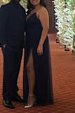The dress is super cute, it does run long but got that altered. - Crystal M.