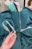 This dress is stunning in theory, but when it arrived to my home, it was falling apart. The glittery silver strip was coming completely off and I had to glue it back together. Then at the wedding I attended, another piece fell off while I was at the cocktail hour. Pretty embarrassing but I got my money back. Not worth the price. - Graci M.