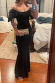 Material is stretchy, very flattering, has bra pads, holds up nicely. A little long, but fine with the right size heels. Bows are attached by a single thread, and one came loose by the end of the night. Wore to a wedding and was comfortable all evening. - Isabella B.