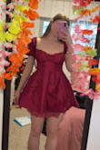 It is a cute and bold statement. The lace up back creates a cinched waist and a flared skirt. Great for dancing! - Megan F.