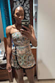 If you're tall like me (5 ft 9 in), it will ride/sit well up your lil bum, but it looks fantastic. For small busts, I recommend a strapless bra for the best fit. - Tia S.