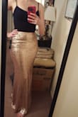 I really love this skirt -- the cut is very flattering and the length is great (it can sit high, at the waist), and the inside and very top hem are lined so you don't feel any itchy sequins.

I ordered a size XS because that's all that was left. I probably would actually be a small, cause the skirt is a little light at the waist, but not unwearable, so I'm definitely keeping it! And as mentioned, the length is still great. I would say it runs true to size cause I should probably be a small. - Emily B.