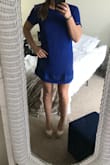 The top layer is a stretchy more casual material and the bottom is more silky. The dress was shorter and a little smaller cut than I imagined since I did get a large but it is a really nice dress. Not dressy enough for a formal occasion but would recommend. - Jennifer K.