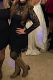 I bought this in black. I wouldn't typically wear this type of neckline but it's the only lace dress I could find I thought would look good with tan cowgirl boots that I wore with it. There is a thick tulle that comes over the dress to give it a tulip shape and the bottom. Mine was shipped with it folded in half horizontally so the shape ended up just being odd and not flattering. I don't know if because of shipping or just the dress. With that being said I had the tule cut out and the sleeves taken up. I could have had a small, but the medium was comfortable. I ended up spending as much on alterations as the dress cost. Overall it is OK but probably would have kept looking if I had time prior to the wedding I was attending. - Echo M.