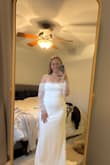 Beautiful dress! Exactly like the picture. The body material is stretchy which is great. The only issue like everyone else said is that it's very tight on the arms. I'm in the process of losing weight so I will not change the size but would recommend sizing up if you want to be able to lift your arms over your head. - Amanda D.