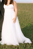 This dress was perfect for the price. My husband and I eloped and I needed a cheap yet cute dress! It only took about 1.5 weeks to arrive.

There are 3 layers to the dress, the bottom is a satin layer, the middle is a lace layer, and the top is a tulle layer. You will need to steam each layer to flatten them out!

I am short and this dress was super long on me. I had a friend hem this dress to the correct length. (We took off about 5-6 in of the tulle layer) 

The straps were super long. We also had to cut and sew these to a shorter length since there are no adjusters on it. 

Dress is very comfortable and looks fantastic! - Mackenzie H.