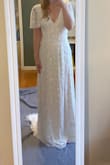 Absolutely love this dress! Looks just like the photos and the beading is stunning. I ordered a medium and it fit me perfectly. Highly recommend as a bride on a budget. - Jeremy M.