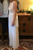 I loved this dress. I needed a white maxi dress for my early spring bridal shower that wouldn't look too much like a wedding dress and this fit the bill exactly.
Downsides: The length of this dress in XS is designed for someone 6'ft , but 95% of people ordering a size XS will be under 5'4. It cost me almost as much to hem the dress as the dress cost itself, because it had 3 layers (each layer was $18). I also paid another $20 to have the straps taken in a bit.
STILL - I don't fault Lulus for my height challenges and was really happy with dress and their AMAZING customer service! - Susan M.