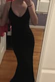 I was scared when I first bought this dress that it wouldn't fit, and it's a little loose in the hips just a tad, but overall I love it. The V-line isn't too low and it isn't super tight but it is tight in all the right places. The material is great, a little thick but not heavy. It's a tiny bit too long when I wear 3 inch heels but honestly i'm not even worried about it. Would definitely recommend this dress. - Kayla S.