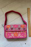 It's still a nice bag, but the colors are nowhere near what is shown in the photos. The bag is more magenta with bolder colors compared to the more muted colors in the clearly edited listing photo. - Tammy B.