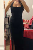 this dress is fitted and super flattering but still good for a nice event. the material is thick and has a little stretch. could've been a bit tighter in the bust but nothing a push up bra can't fix. if you need a classy black dress that will make you look amazing, get this!! - Amarae W.