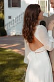 I wanted an affordable dress for my brunch wedding and this dress checked all the boxes: pure white, light material, form-fitting but not rigid/stiff, flattering, and most of all, great quality AND price. This is lined (I still wore nude underwear) and used nude breast tape. I did not have it hemmed. I am 5'6 (34in bust, 26-27in waist and 38in hip) and had on 2.5-3in heels. It brushed the ground perfectly, but I did find myself holding it up some of the day, personal preference I suppose. The tie fit perfectly on my waist and is very forgiving around the stomach (back has an elastic in it) If you're a bride on a budget, I highly recommend this dress! After my wedding, I placed it in a laundry bag, gentle cycle and hung to dry- it looks brand new! - Erica D.