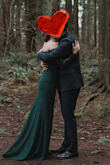 This dress was perfect for our Forest elopement. It came out of the bag and fit perfectly! I ordered a small in two dresses from Lulus and with my measurements, they were exactly the size for me. The off-the-shoulder sleeve on this dress has sticky strips to help them stay up, as well as across the chest and back. I didn't adjust my dress once (unusual for a strapless dress)! As others mentioned, your ability to raise your arms in the air fully is restricted a bit, but we didn't have a dance reception so this wasn't a concern for me- I didn't need to wave my hands in the air like I didn't care at any point. On my 5'4 height, with two inch heels, it was still a little long. Honestly, I was so complimented and felt so elegant and put together for such a good price. It was an amazing dress. - Stef S.