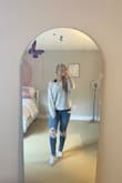 I got a small and it does run large but I think that's the point. It's a bit oversized and cozy. I wear this everywhere with leggings or jeans. - Charissa G.